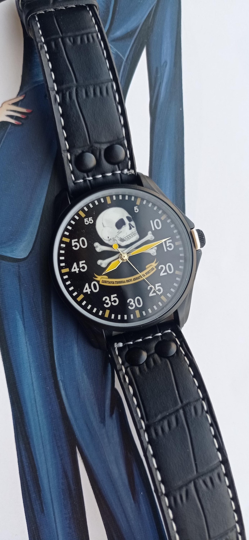 Men’s military quartz wristwatch inspired by the Spanish Army 8th Cavalry Regiment “Lusitania,” featuring a bold black dial with striking skull and crossbones emblem, a symbol of bravery, courage, and sacrifice. This collectible watch includes a precise quartz movement, durable black case, and a black leather strap with white stitching. Perfect for military history collectors, army enthusiasts, and men’s fashion lovers, this unworn timepiece represents unique heritage, bold design.