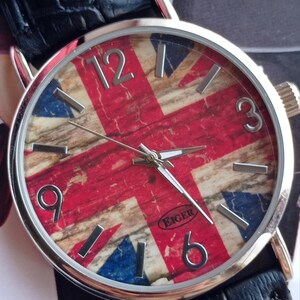 New wristwatch featuring the Union Jack (British flag) on the dial, with a black faux leather strap and silver buckle. Unused quartz timepiece, stylish and perfect for fans of British culture or punk fashion.