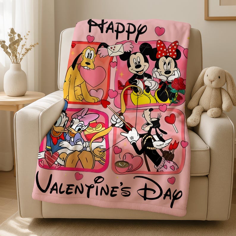A pink blanket with a collage of Disney characters and the text "Happy Valentine's Day" is displayed on a chair.