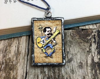 One Man Band: soldered glass pendant