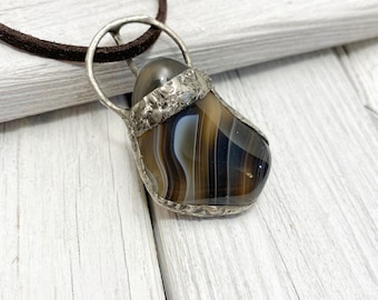 Banded agate in textured pewter setting pendant.