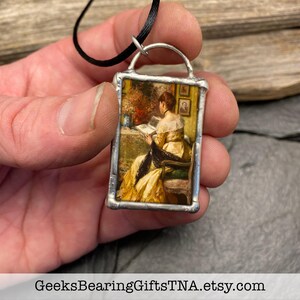 Pendant with vintage Victorian artwork and inspiring quote about books by Geeks Bearing Gifts. image 2