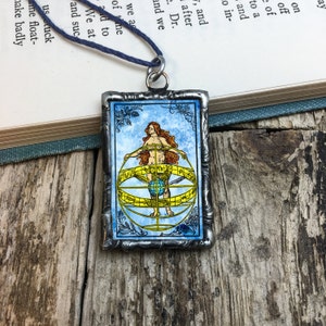 Medieval Armillary Sphere and Sky Goddess with Carl Sagan Quote, soldered glass pendant by Geeks Bearing Gifts.