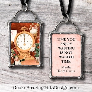Glass and pewter pendant with a vintage image of a clock, elves, and a quote about wasted time. By Geeks Bearing Gifts.