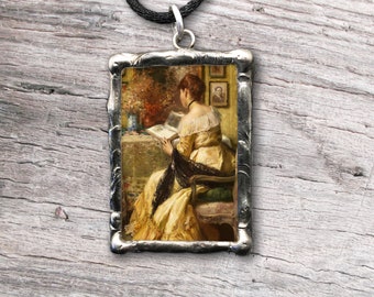 Pendant with vintage Victorian artwork and inspiring quote about books