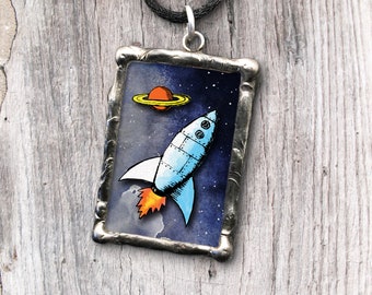 Spaceflight pendant with inspiring quote