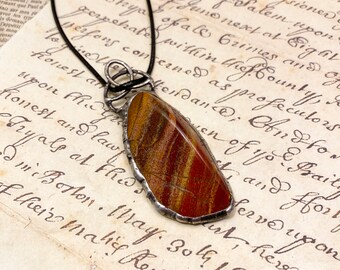 Red jasper stone in a hand-formed pewter setting.