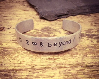 To Infinity and Beyond!, hand hammered, hand stamped, cuff bracelet.