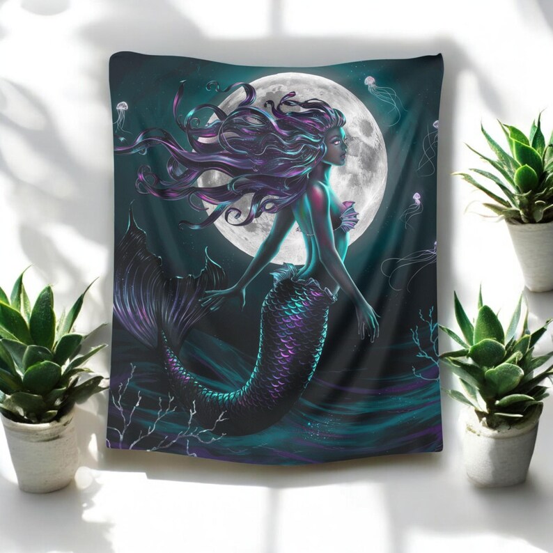 May include: A tapestry featuring a mermaid with long, flowing purple hair and a teal tail. The mermaid is swimming in a dark blue ocean with a full moon in the background. There are jellyfish and coral in the water.