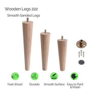 May include: Three smooth, sanded wooden furniture legs of varying heights, with a light brown finish. The image includes hardware such as screws and a mounting plate. Text on the image reads "Wooden Legs 222" and "Smooth Sanded Legs."
