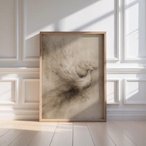 A delicate phoenix sketch is elegantly framed in light wood, casting a warm glow in a sunlit, sophisticated room, perfect for fantasy wall art enthusiasts. This vintage art piece brings a touch of magical creatures into a literary haven.