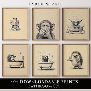 May include: Set of six framed bathroom art prints. Each print features a whimsical black and white illustration of animals, including a frog, monkey, and hedgehog. The prints are displayed on a light beige background. Text at the bottom reads "40+ DOWNLOADABLE PRINTS BATHROOM SET".