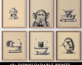 May include: Set of six framed bathroom art prints. Each print features a whimsical black and white illustration of animals, including a frog, monkey, and hedgehog. The prints are displayed on a light beige background. Text at the bottom reads "40+ DOWNLOADABLE PRINTS BATHROOM SET".