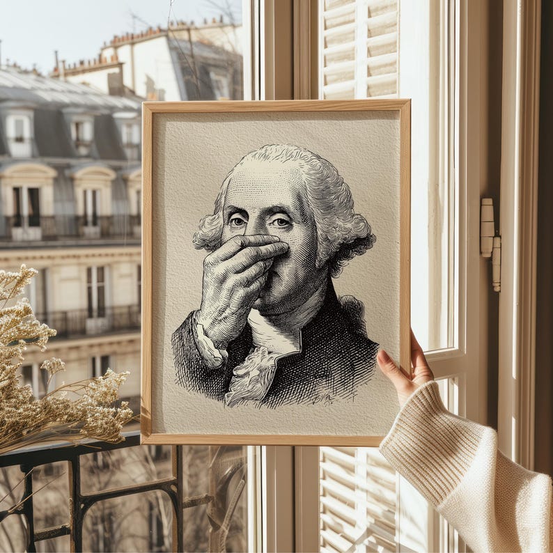 A whimsical vintage sketch of George Washington humorously pinching his nose is framed in sleek natural wood, perfect for adding funny bathroom art to any space. Bathed in soft, natural light, this piece brings a touch of funny decor to vintage settings.