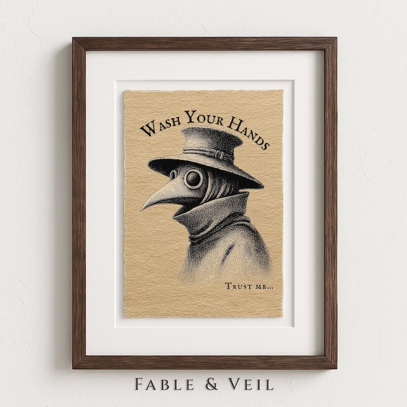 A whimsical plague doctor art piece in an elegant wooden frame, perfect for adding a touch of funny bathroom art. Set against a textured white backdrop, this moody decor blends humor with a hint of horror wall art.