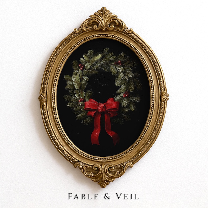 A gold-framed moody painting of a festive evergreen wreath with a red bow exudes a moody Christmas mood, perfect for Ralph Lauren Christmas decor.