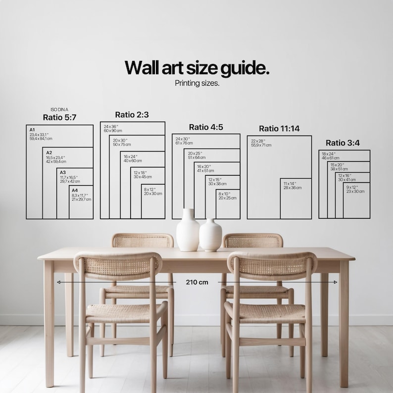 A minimalist dining room with light wooden furniture and elegant white vases sits beneath a modern wall art size guide, embodying a light academia aesthetic.