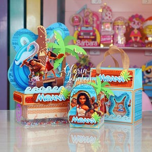 May include: A collection of Moana-themed party decorations. The set includes a box with a handle, a box with a clear front, and a smaller box. Each box features images of Moana characters, palm trees, and the word "Moana".