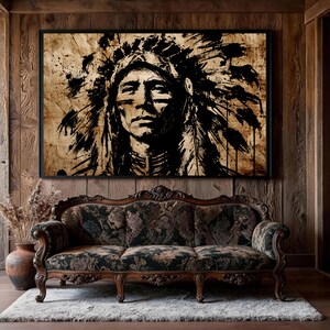 May include: A rectangular wall art print featuring a high-contrast black ink illustration of a person wearing a traditional feathered headdress. The artwork is rendered in a distressed, splattered style against a textured, light brown background.