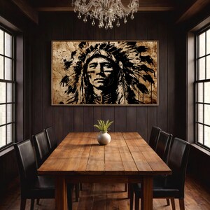May include: A rectangular wall art print featuring a high-contrast black ink portrait of a person wearing a traditional feathered headdress, set against a textured, sepia-toned background with visible paint splatters and brushstroke details.