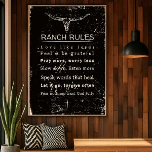 May include: Black framed wall art with the text "RANCH RULES" and a steer skull illustration. The text includes phrases like "Love like Jesus" and "Fear nothing: trust God fully". The art has a distressed, vintage look.