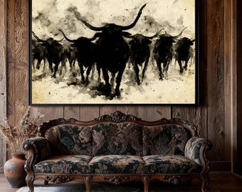 May include: A framed wall art print featuring a black ink wash illustration of a herd of longhorn bulls charging forward against a textured, cream-colored background. The artwork displays high-contrast silhouettes with expressive, splattered ink details.