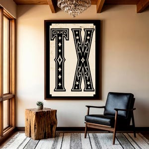 May include: A rectangular wall art piece featuring the letters TX in a bold, black, decorative serif font on a cream-colored background. The letters are adorned with intricate filigree, star, and diamond patterns, all enclosed within a thick black frame.
