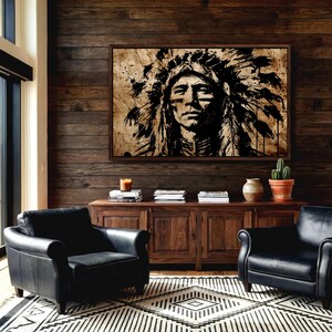 May include: A rectangular wall art print featuring a high-contrast black ink illustration of a person wearing a traditional feathered headdress. The artwork is displayed in a dark wooden frame and mounted on a dark horizontal wood plank wall.