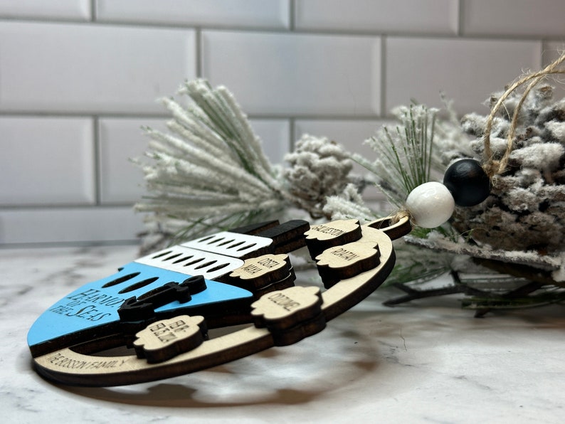 This beautifully crafted customized cruise ship ornament is the perfect way to commemorate your nautical adventures. Handmade with care, this charming ornament can be personalized with your family name, ship name, ports and cruise dates.