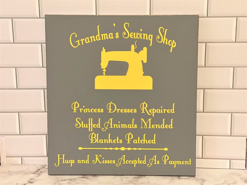 Celebrate Grandma’s love for sewing, quilting, and crafting with this handmade custom wood sewing room sign! Perfect for hanging in her sewing room, craft room, or quilting studio, this rustic wooden sign adds a warm, personal touch to her creative space. Whether you’re looking for a thoughtful gift for Grandma, a unique Mother’s Day present, or a way to make her sewing corner extra special, this personalized sign will be treasured for years to come. Customizable with any name you choose.