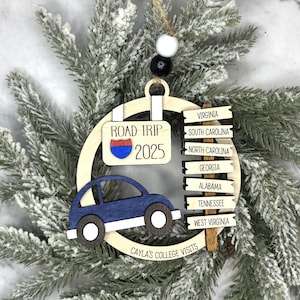 Add a touch of charm to your Christmas tree with our laser engraved wood road trip ornament. Handcrafted with love, this unique piece captures the essence of adventure. Perfect for travel enthusiasts and wanderlust souls! A wonderful gift for anyone who loves hitting the open road. We can add up to 7 locations on this ornament to customize this to your favorite adventure. Order yours today!
