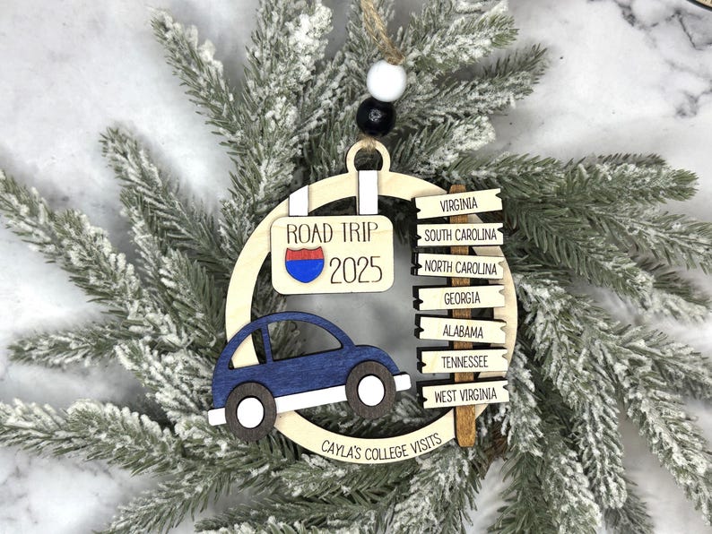 Add a touch of charm to your Christmas tree with our laser engraved wood road trip ornament. Handcrafted with love, this unique piece captures the essence of adventure. Perfect for travel enthusiasts and wanderlust souls! A wonderful gift for anyone who loves hitting the open road. We can add up to 7 locations on this ornament to customize this to your favorite adventure. Order yours today!