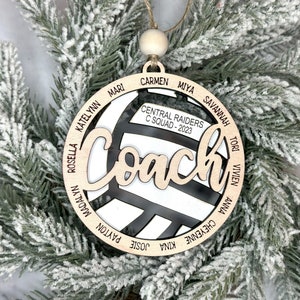 Custom coach volleyball ornament comes customized with the team name, year and up to 16 player names.  Double layered laser engraved ornament measures approx. 3.5" in diameter and comes with decorative bead and twine.