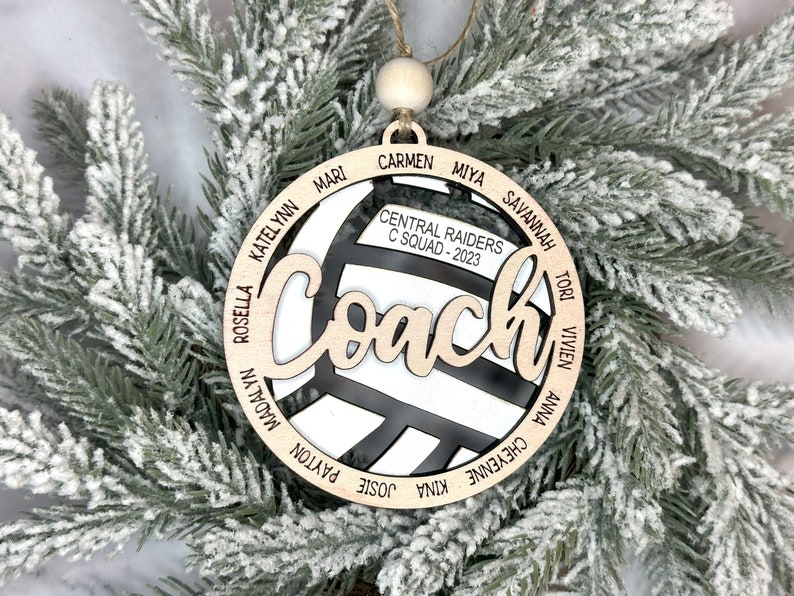 Custom coach volleyball ornament comes customized with the team name, year and up to 16 player names.  Double layered laser engraved ornament measures approx. 3.5" in diameter and comes with decorative bead and twine.