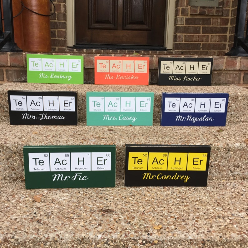 Teacher desk name plate for your best science teacher!  Chemistry teacher, Biology teacher or principal.  This custom wood sign measures approx. 5 1/4"x11" and states:

TeAcHEr
Teacher's Name