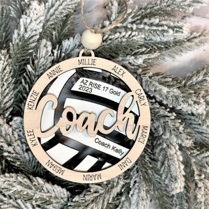 Custom coach volleyball ornament comes customized with the team name, year and up to 16 player names.  Double layered laser engraved ornament measures approx. 3.5" in diameter and comes with decorative bead and twine.