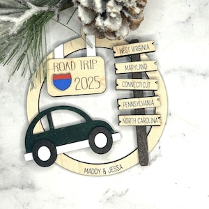 Add a touch of charm to your Christmas tree with our laser engraved wood road trip ornament. Handcrafted with love, this unique piece captures the essence of adventure. Perfect for travel enthusiasts and wanderlust souls! A wonderful gift for anyone who loves hitting the open road. We can add up to 7 locations on this ornament to customize this to your favorite adventure. Order yours today!