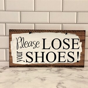 Please lose your shoes comes with holes and is easy to hang on any basket.  Basket and ribbons not included.  Comes in a variety of colors.