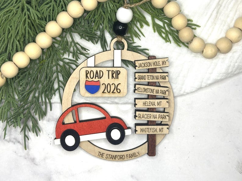 Add a touch of charm to your Christmas tree with our laser engraved wood road trip ornament. Handcrafted with love, this unique piece captures the essence of adventure. Perfect for travel enthusiasts and wanderlust souls! A wonderful gift for anyone who loves hitting the open road. We can add up to 7 locations on this ornament to customize this to your favorite adventure. Order yours today!
