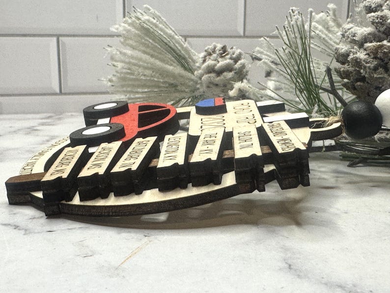 Add a touch of charm to your Christmas tree with our laser engraved wood road trip ornament. Handcrafted with love, this unique piece captures the essence of adventure. Perfect for travel enthusiasts and wanderlust souls! A wonderful gift for anyone who loves hitting the open road. We can add up to 7 locations on this ornament to customize this to your favorite adventure. Order yours today!