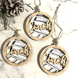 Custom coach volleyball ornament comes customized with the team name, year and up to 16 player names.  Double layered laser engraved ornament measures approx. 3.5" in diameter and comes with decorative bead and twine.