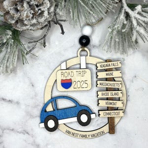 Add a touch of charm to your Christmas tree with our laser engraved wood road trip ornament. Handcrafted with love, this unique piece captures the essence of adventure. Perfect for travel enthusiasts and wanderlust souls! A wonderful gift for anyone who loves hitting the open road. We can add up to 7 locations on this ornament to customize this to your favorite adventure. Order yours today!