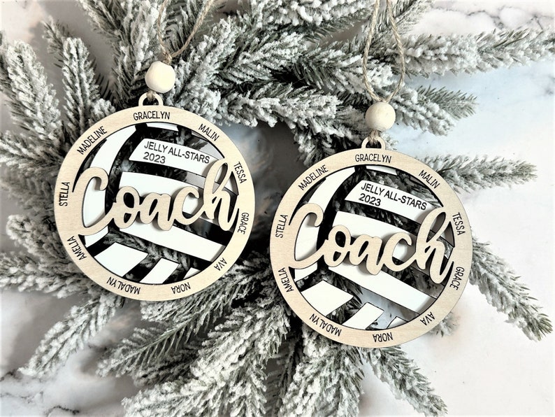 Custom coach volleyball ornament comes customized with the team name, year and up to 16 player names.  Double layered laser engraved ornament measures approx. 3.5" in diameter and comes with decorative bead and twine.