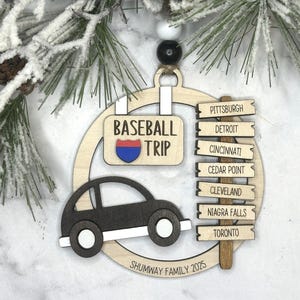 Add a touch of charm to your Christmas tree with our laser engraved wood road trip ornament. Handcrafted with love, this unique piece captures the essence of adventure. Perfect for travel enthusiasts and wanderlust souls! A wonderful gift for anyone who loves hitting the open road. We can add up to 7 locations on this ornament to customize this to your favorite adventure. Order yours today!