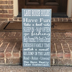 Custom wood sign measures approx. 11 1/4 x 23 inches and states: 

Lake House Rules
Have Fun
Take A Boat Ride
Sleep In - Nap Often
Go Fishing
Help Yourself To Food & Drink
Cherish Family Time
Watch A Sunset
Go Jump In The Lake
Read - Relax - Unwind