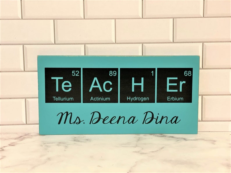 Teacher desk name plate for your best science teacher!  Chemistry teacher, Biology teacher or principal.  This custom wood sign measures approx. 5 1/4"x11" and states:

TeAcHEr
Teacher's Name