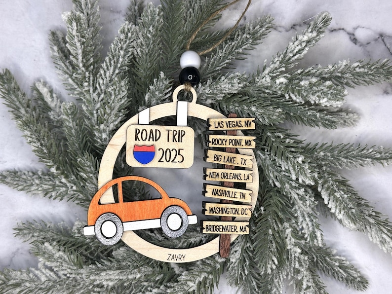 Add a touch of charm to your Christmas tree with our laser engraved wood road trip ornament. Handcrafted with love, this unique piece captures the essence of adventure. Perfect for travel enthusiasts and wanderlust souls! A wonderful gift for anyone who loves hitting the open road. We can add up to 7 locations on this ornament to customize this to your favorite adventure. Order yours today!