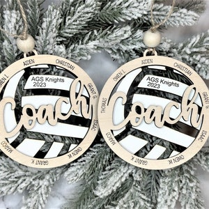 Custom coach volleyball ornament comes customized with the team name, year and up to 16 player names.  Double layered laser engraved ornament measures approx. 3.5" in diameter and comes with decorative bead and twine.