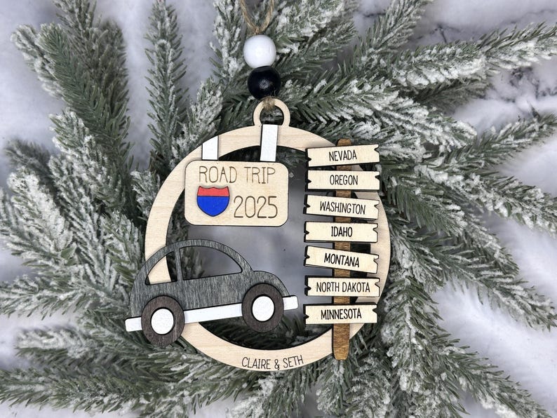 Add a touch of charm to your Christmas tree with our laser engraved wood road trip ornament. Handcrafted with love, this unique piece captures the essence of adventure. Perfect for travel enthusiasts and wanderlust souls! A wonderful gift for anyone who loves hitting the open road. We can add up to 7 locations on this ornament to customize this to your favorite adventure. Order yours today!