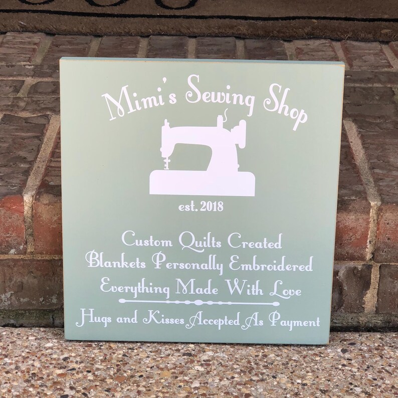 Celebrate Grandma’s love for sewing, quilting, and crafting with this handmade custom wood sewing room sign! Perfect for hanging in her sewing room, craft room, or quilting studio, this rustic wooden sign adds a warm, personal touch to her creative space. Whether you’re looking for a thoughtful gift for Grandma, a unique Mother’s Day present, or a way to make her sewing corner extra special, this personalized sign will be treasured for years to come. Customizable with any name you choose.